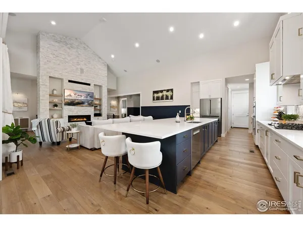 a large kitchen with a table and chairs