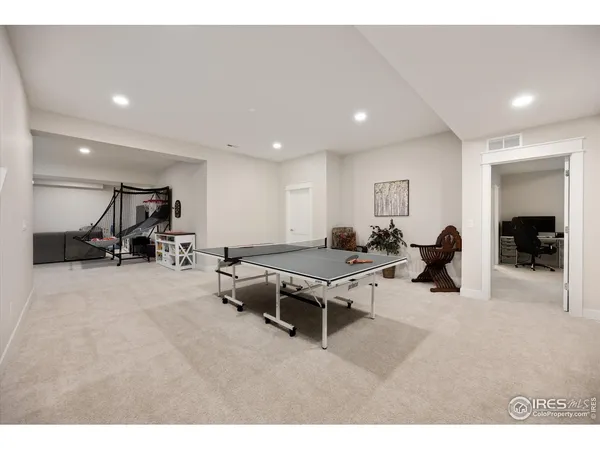 a living room with furniture gym equipment and a view of living room