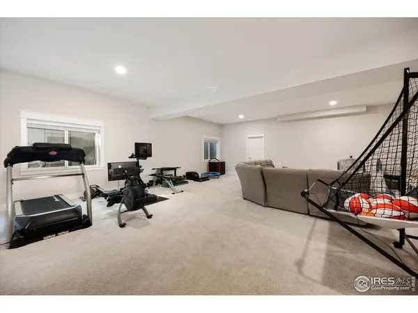 a living room with furniture gym equipment and a view of living room