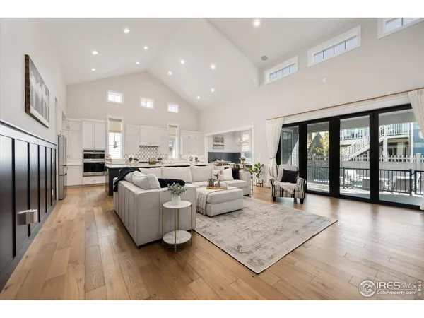 a living room with furniture and large window