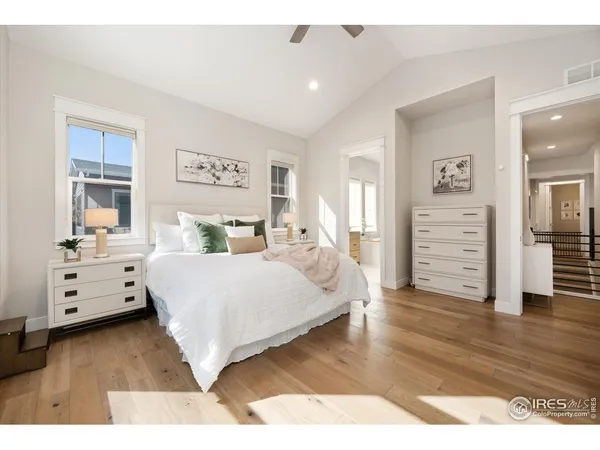 a bedroom with a bed and a view of kitchen