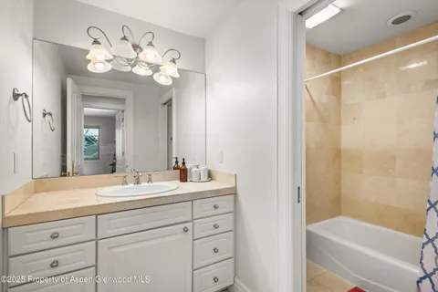 a spacious bedroom with a large bed and a window