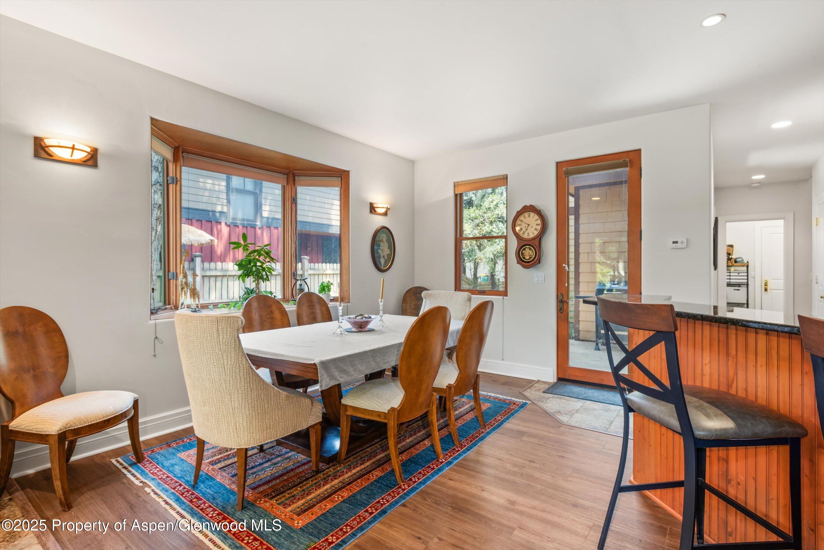 315 Summerset Lane, Unit A Basalt, CO 81621 - Photo 5 of 18 a view of a dining room with furniture a rug and wooden floor