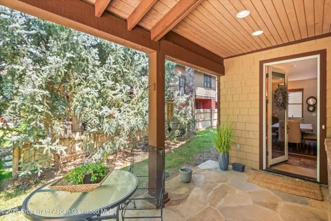 a living room with a outdoor seating space