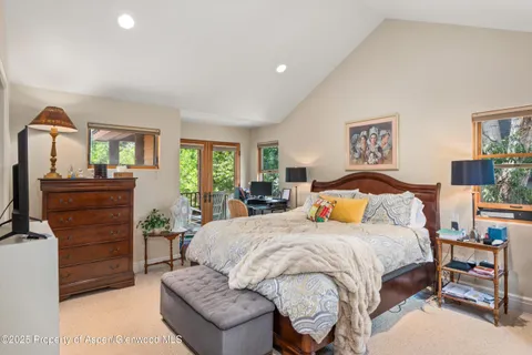 a bedroom with a bed and a furniture