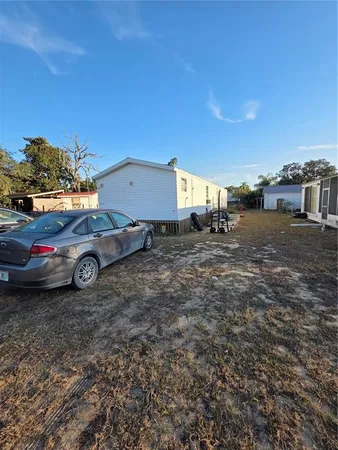 a view of a backyard of a house