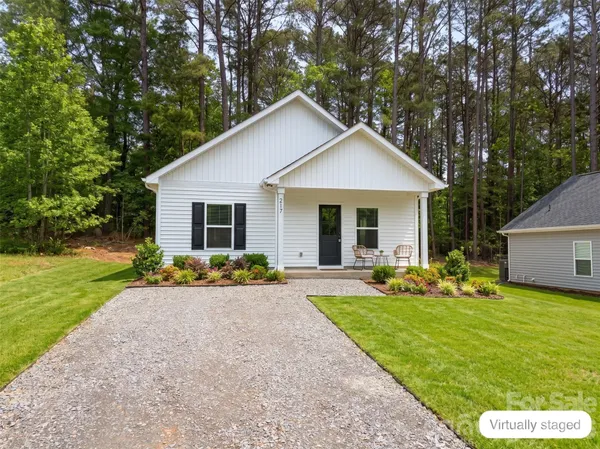 a view of front of house with a yard