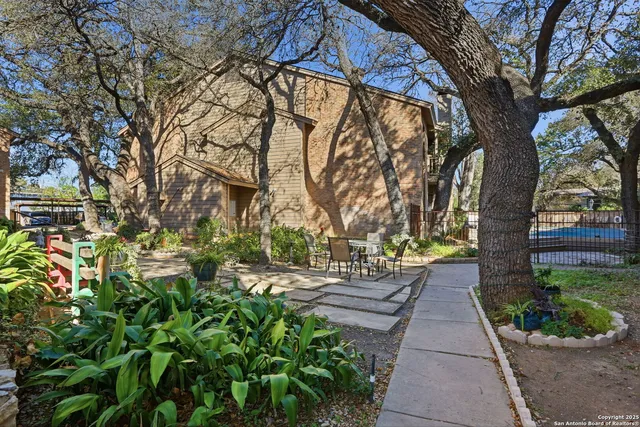 a view of a pathway with a yard