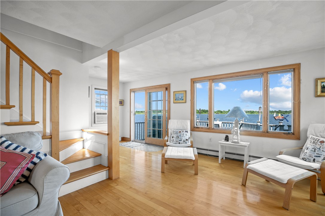309 Riverside Street Portsmouth, RI 02871 - Photo 15 of 48 Living Room with View to Deck & Water