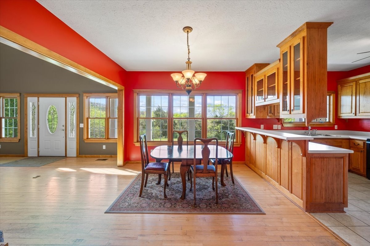 216 Old Wolf Hill Road Bethpage, TN 37022 - Photo 11 of 70 a dining room with furniture a chandelier and wooden floor