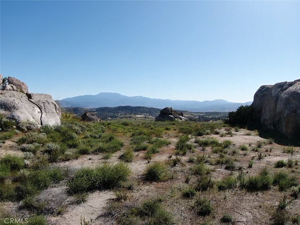23698 Tapatia Road Homeland, CA 92548 - Photo 5 of 11 a view of a green field with lots of bushes