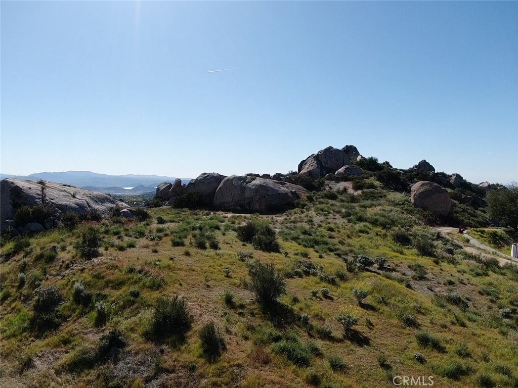 23698 Tapatia Road Homeland, CA 92548 - Photo 8 of 11 a view of a house in a field