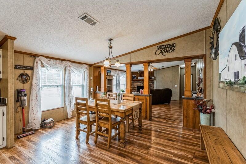 5995 Staff Road Crestview, FL 32536 - Photo 12 of 35 a view of a dining room with furniture window and wooden floor