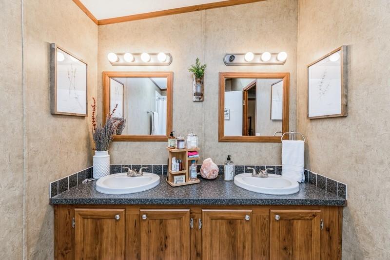 5995 Staff Road Crestview, FL 32536 - Photo 21 of 35 a bathroom with a granite countertop sink and a mirror