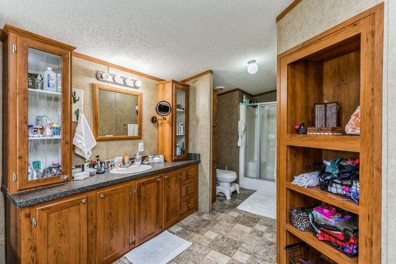 5995 Staff Road Crestview, FL 32536 - Photo 29 of 35 a spacious bathroom with a double vanity sink and a mirror