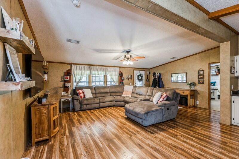 5995 Staff Road Crestview, FL 32536 - Photo 7 of 35 a living room with furniture and a wooden floor