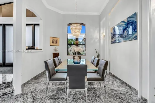 a kitchen with a table and chairs in it