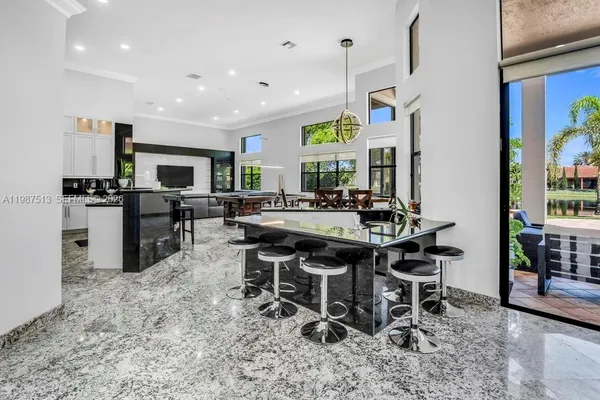 a kitchen with a sink appliances and a window