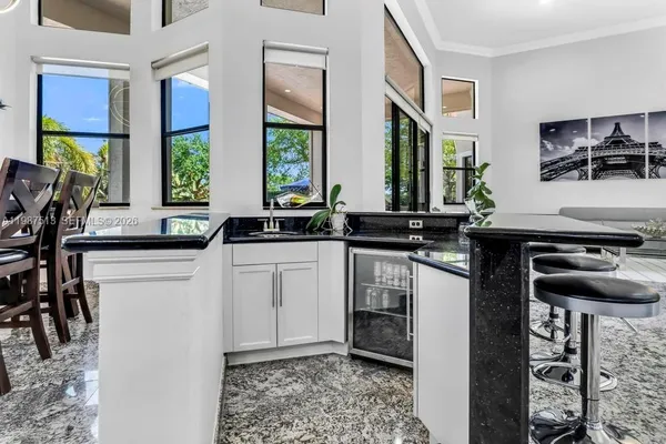 a dining room with furniture and wooden floor