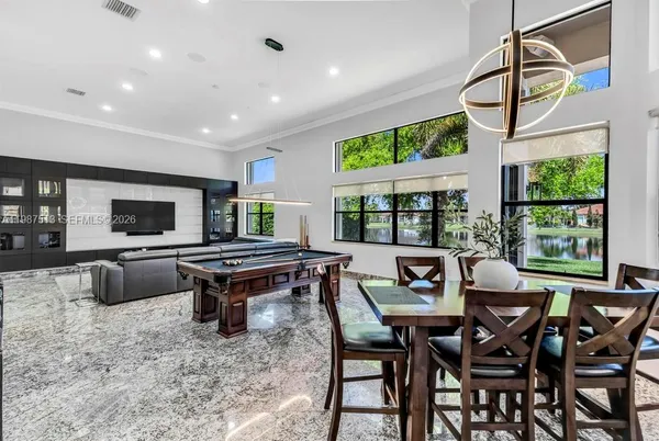 a kitchen with stainless steel appliances and a refrigerator