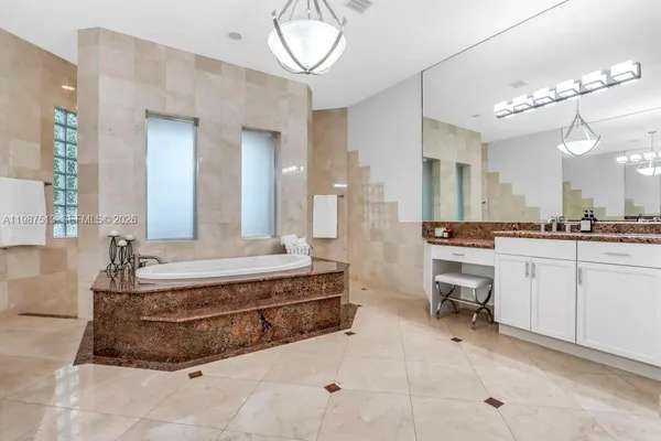 a living room with hard wood floors and a book shelf