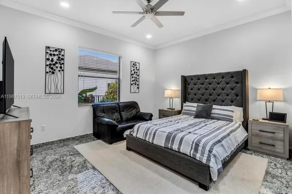 a room with gym equipment and a flat screen tv