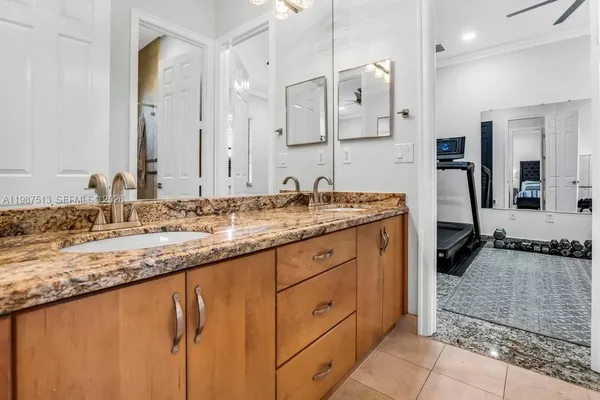 a bedroom with a bed and flat screen tv