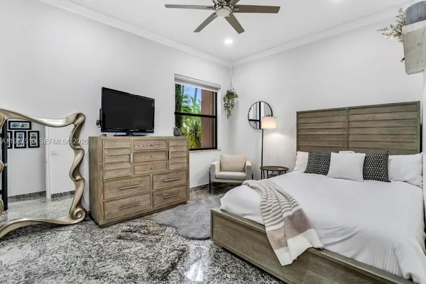 a bedroom with a bed and a window