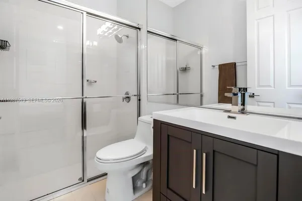 a view of a house with swimming pool and a yard