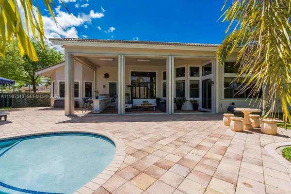 a view of a lake with houses in the background