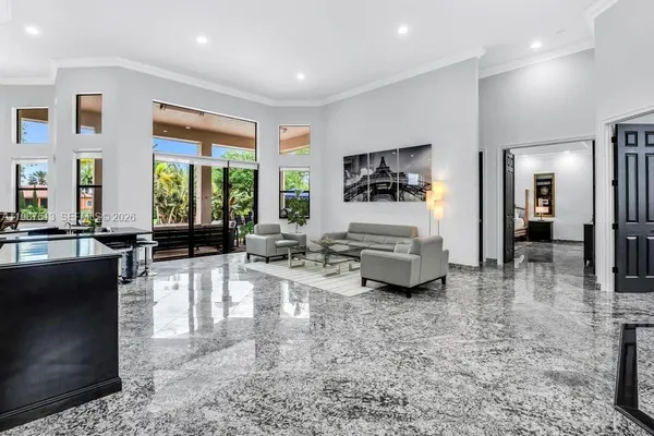 a living room with furniture and a large window