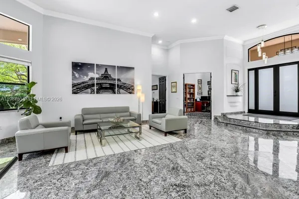 a living room with furniture and a flat screen tv