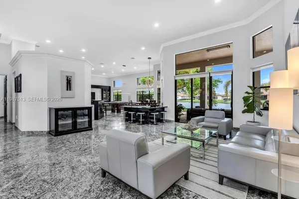 a living room with furniture and a large window