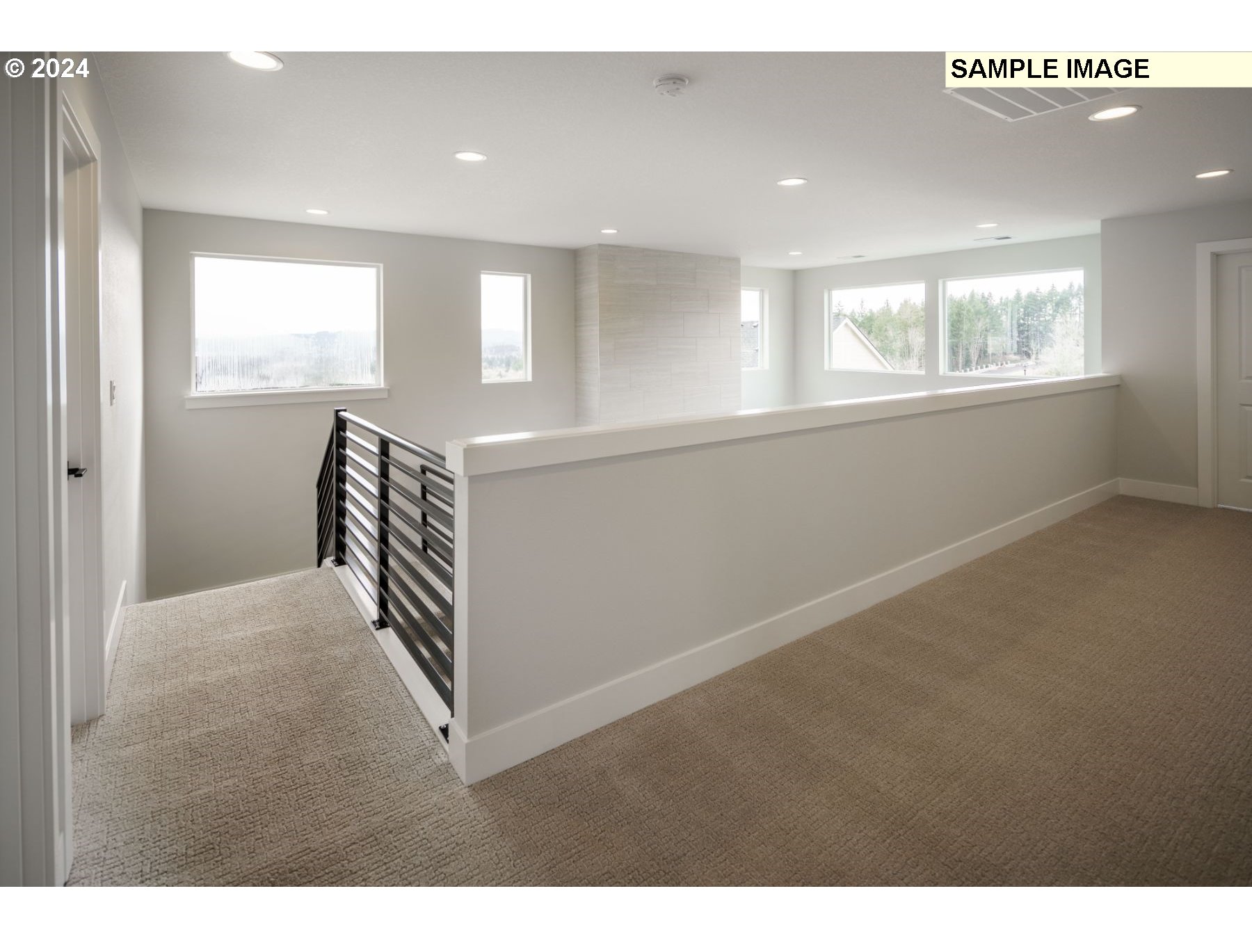 1225 South 46th Place Ridgefield, WA 98642 - Photo 16 of 26 a view of hallway with windows and chandelier