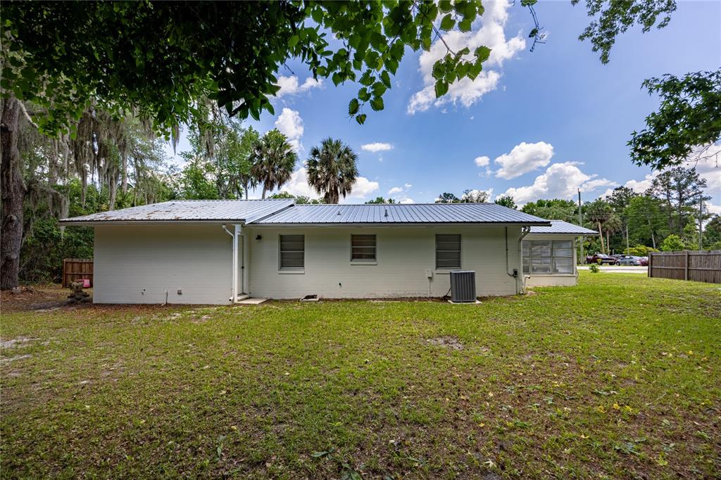 113 Browns Road San Mateo, FL 32187 - Photo 30 of 36 a view of a house with a garden
