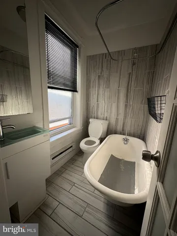 a bathroom with a toilet and a sink
