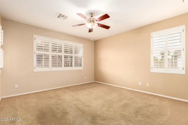 a spacious bathroom with a double vanity sink and a mirror