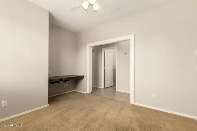 a view of a house with backyard and tree
