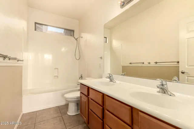 an aerial view of a house with swimming pool and porch