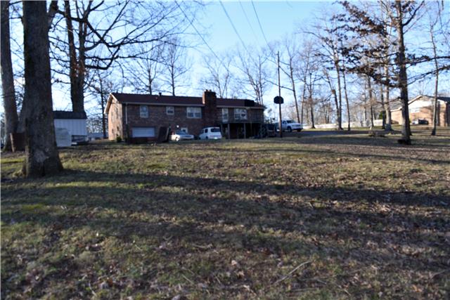 118 Robert Porter Road Dickson, TN 37055 - Photo 3 of 9 Large back yard with plenty of room to roam. 1 car garage with full unfinished basement. Would make a great workshop! Deck needs work. Fireplace in basement can heat the whole house!