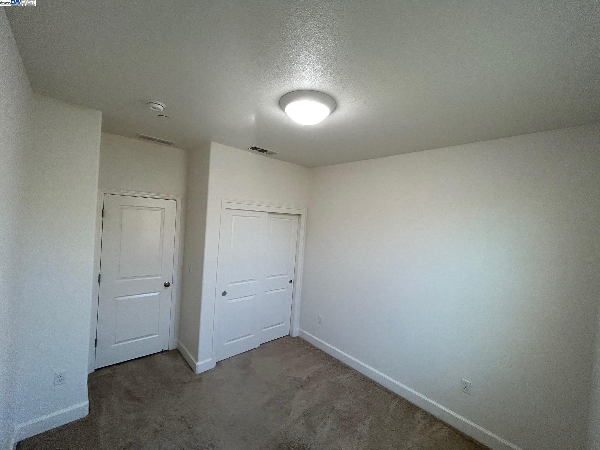 1940 Lee Way Milpitas, CA 95035 - Photo 7 of 11 an empty room with an entryway