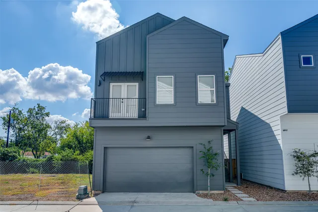a front view of a house with a garage