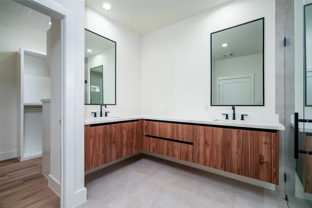a bathroom with a sink and mirror