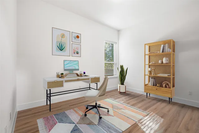 a living room with furniture and a rug