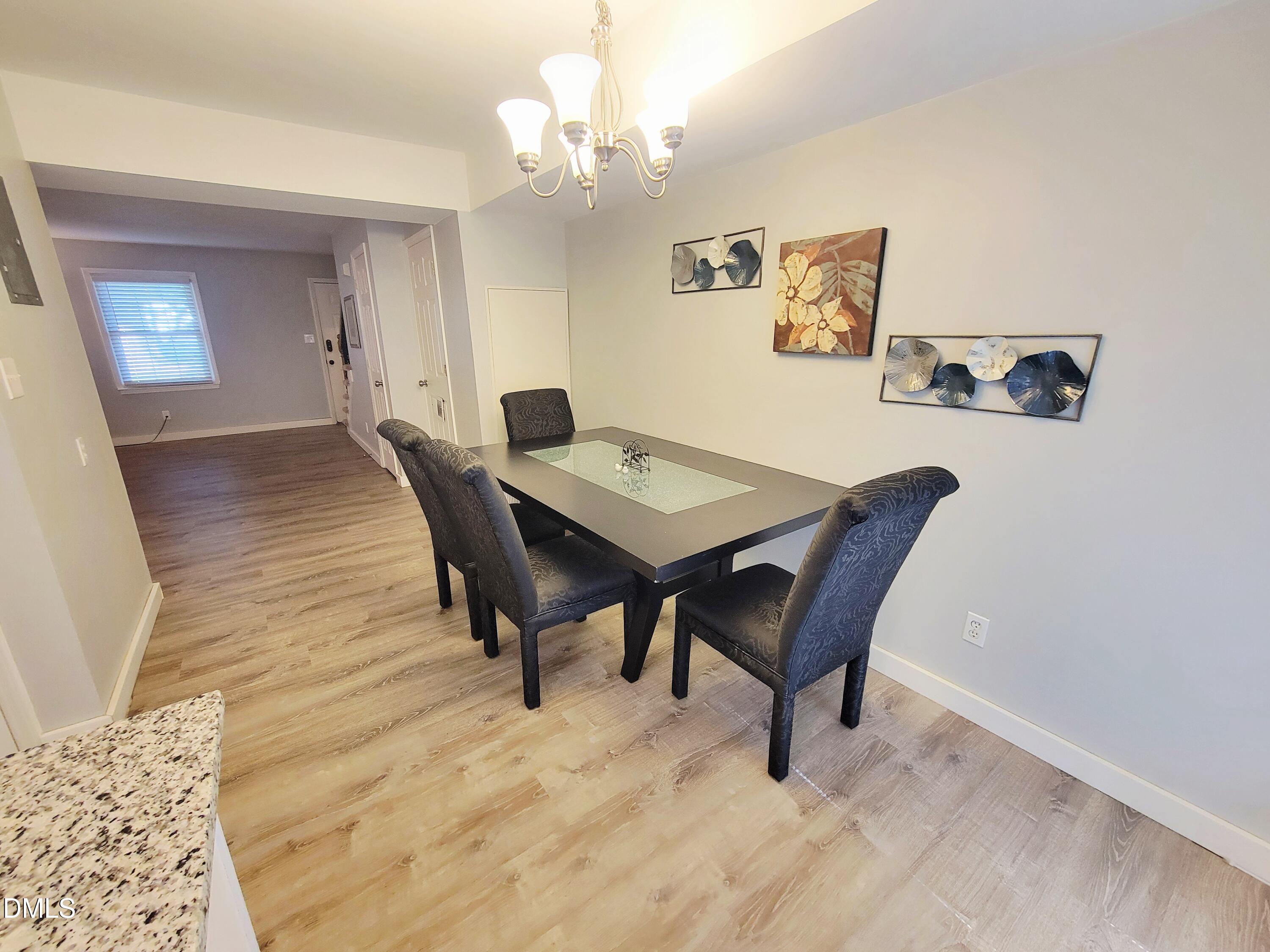 4701 Blue Bird Court Raleigh, NC 27606 - Photo 13 of 42 a view of a dining room with furniture