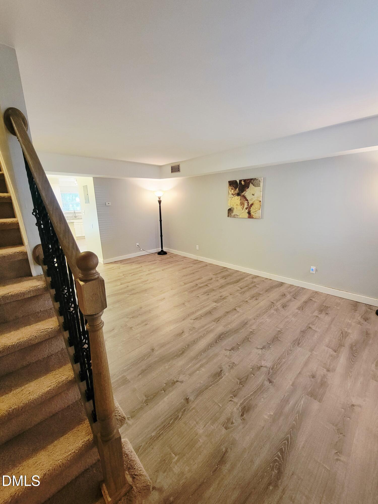 4701 Blue Bird Court Raleigh, NC 27606 - Photo 2 of 42 a view of an empty room with stairs and a window