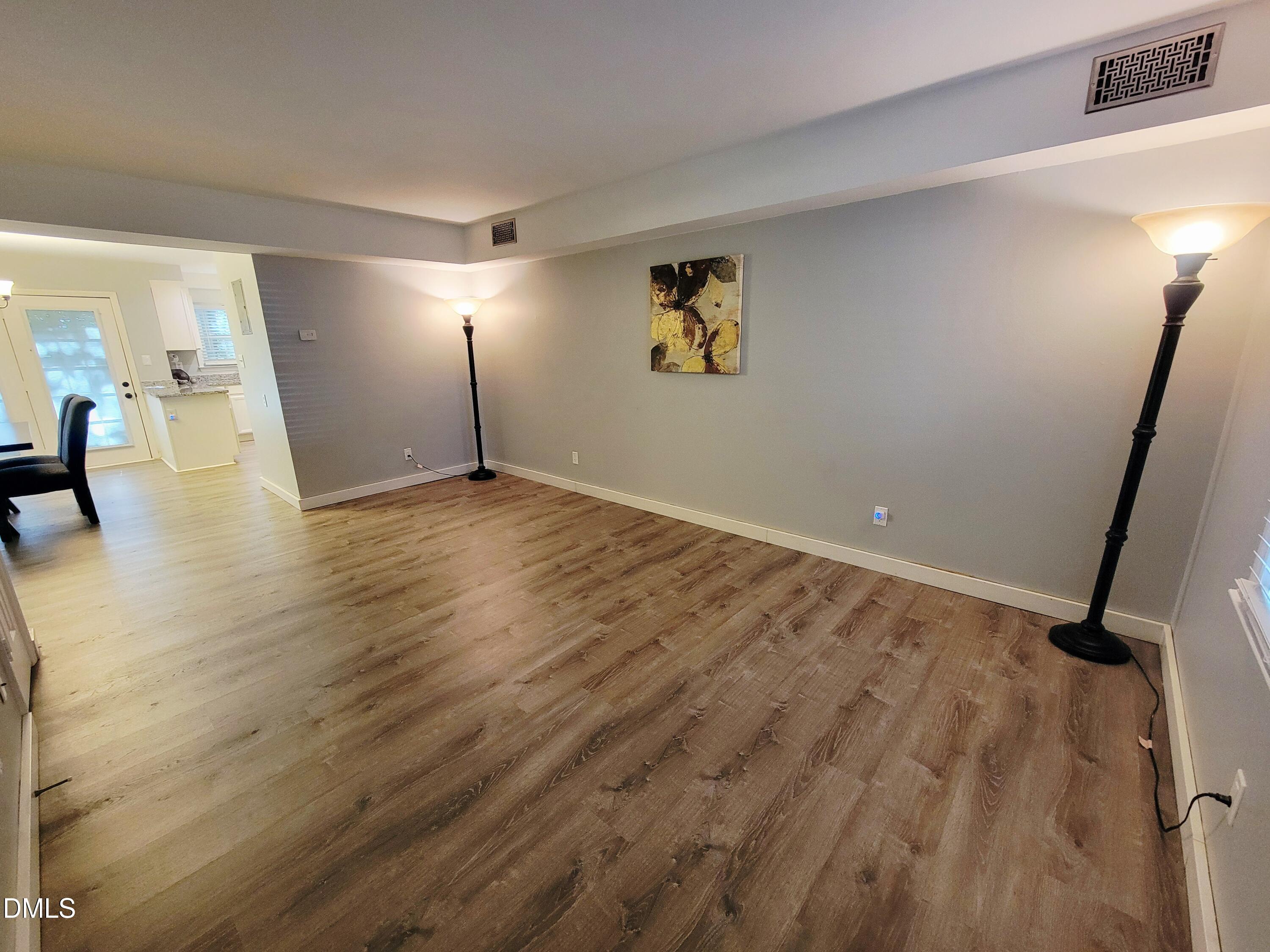 4701 Blue Bird Court Raleigh, NC 27606 - Photo 3 of 42 a view of empty room with wooden floor
