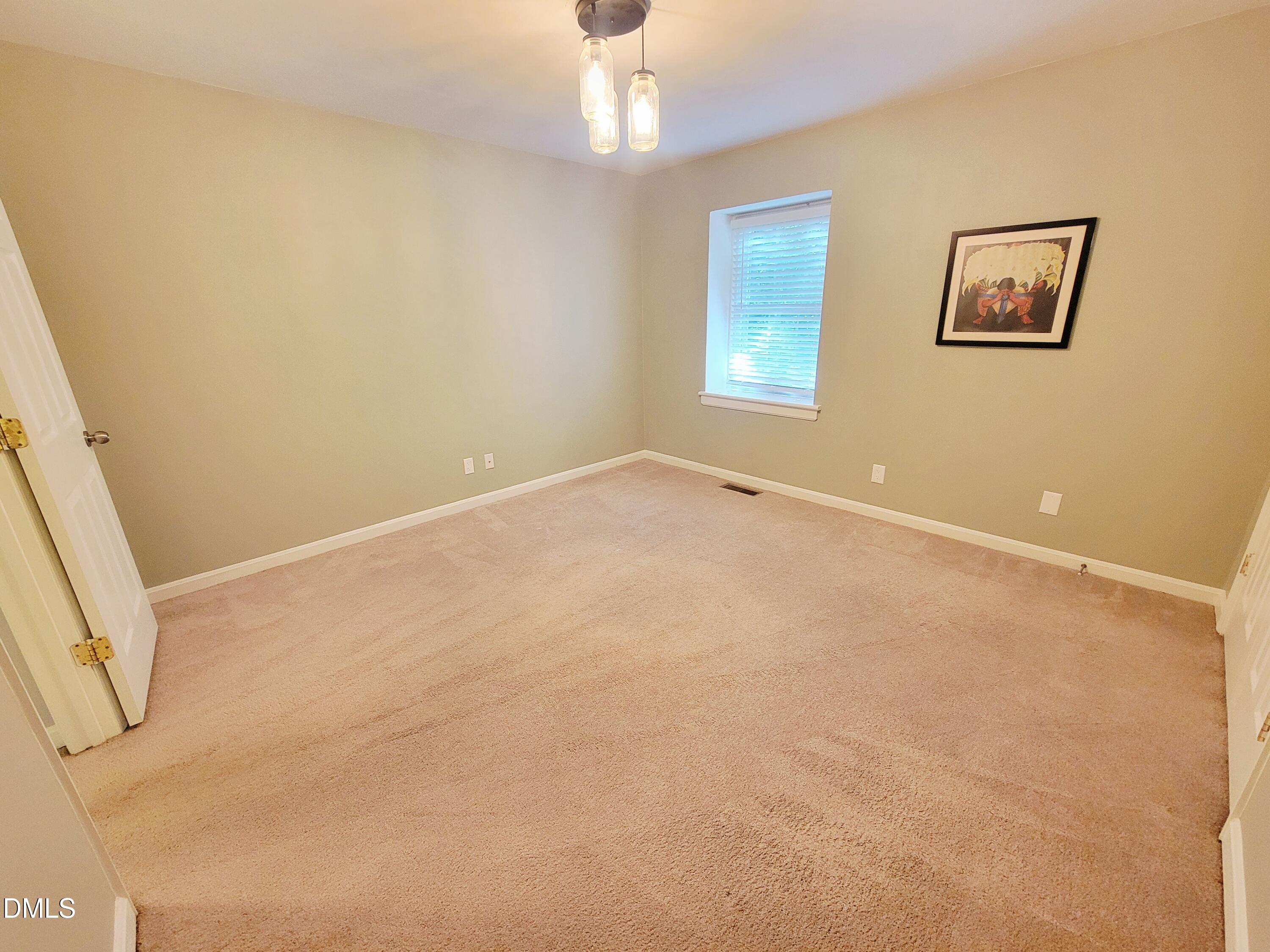 4701 Blue Bird Court Raleigh, NC 27606 - Photo 35 of 42 a view of an empty room with a window