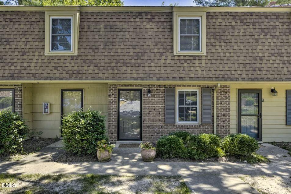 4701 Blue Bird Court Raleigh, NC 27606 - Photo 42 of 42 front view of a brick house with a large windows