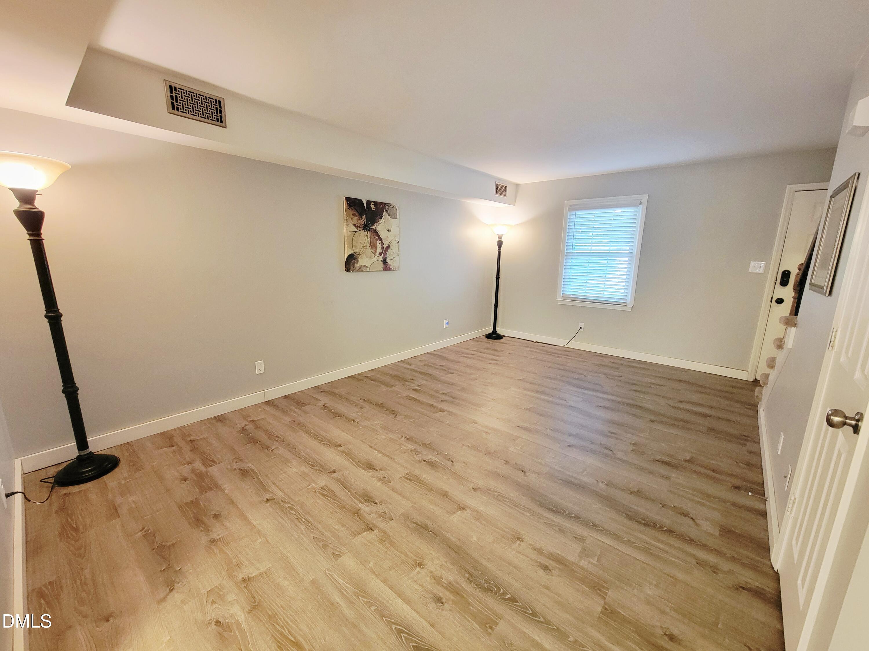 4701 Blue Bird Court Raleigh, NC 27606 - Photo 6 of 42 a view of an empty room with a window